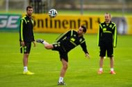 Xavi (centre) and Andres Iniesta (right)